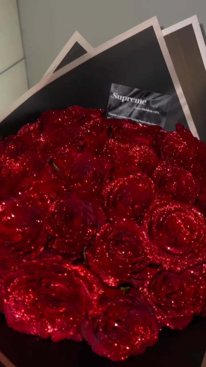 Macro detail of a hand-gilded glitter rose